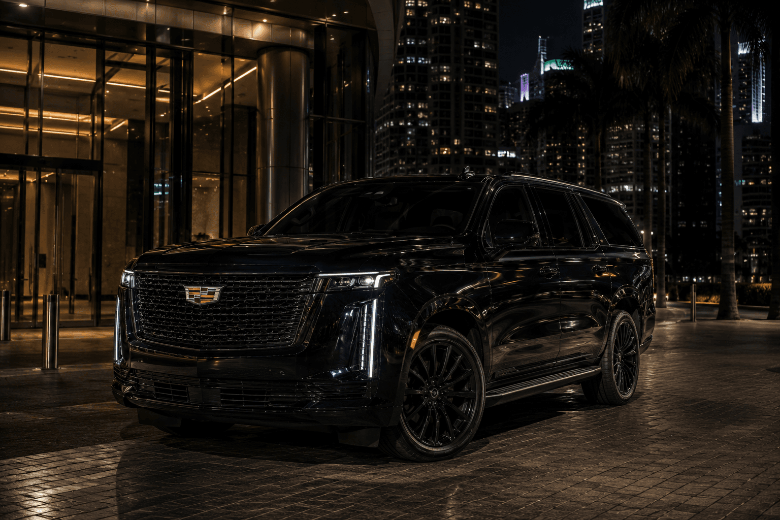 Black Cadillac Escalade at night against the Miami skyline — Octo Prestige Chauffeurs